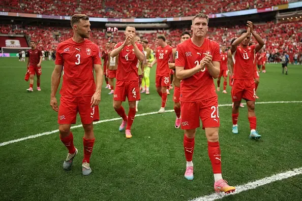 Wilvan Widmer #3 and Michel Aebischer #20 of Switzerland applaud fans