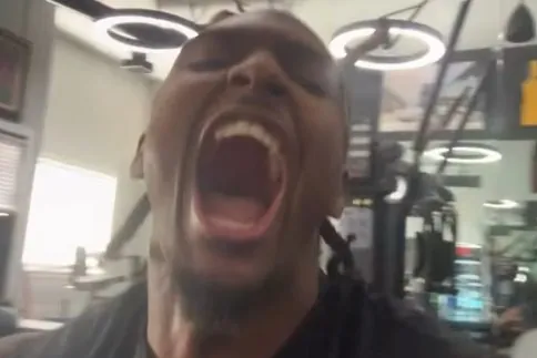 A close up of a Philly NBA star reacting excitedly by yelling into the camera.