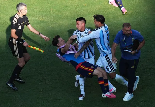 Leandro Paredes (right) was involved in a brawl after full-time of the World Cup final