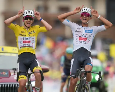 UAE's Tadej Pogacar and Isaac Del Toro strike a pose as they cross the finish line on Alpe d'Huez